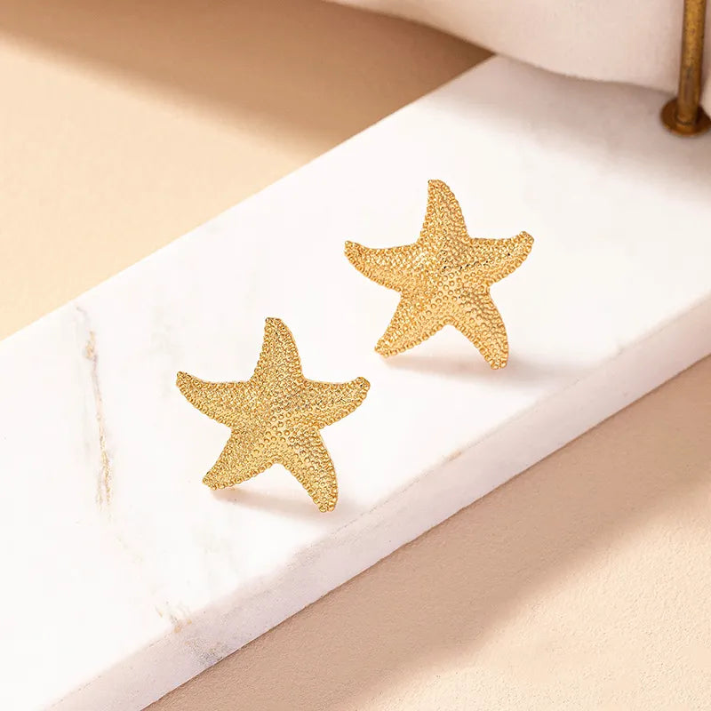 Gold starfish earrings