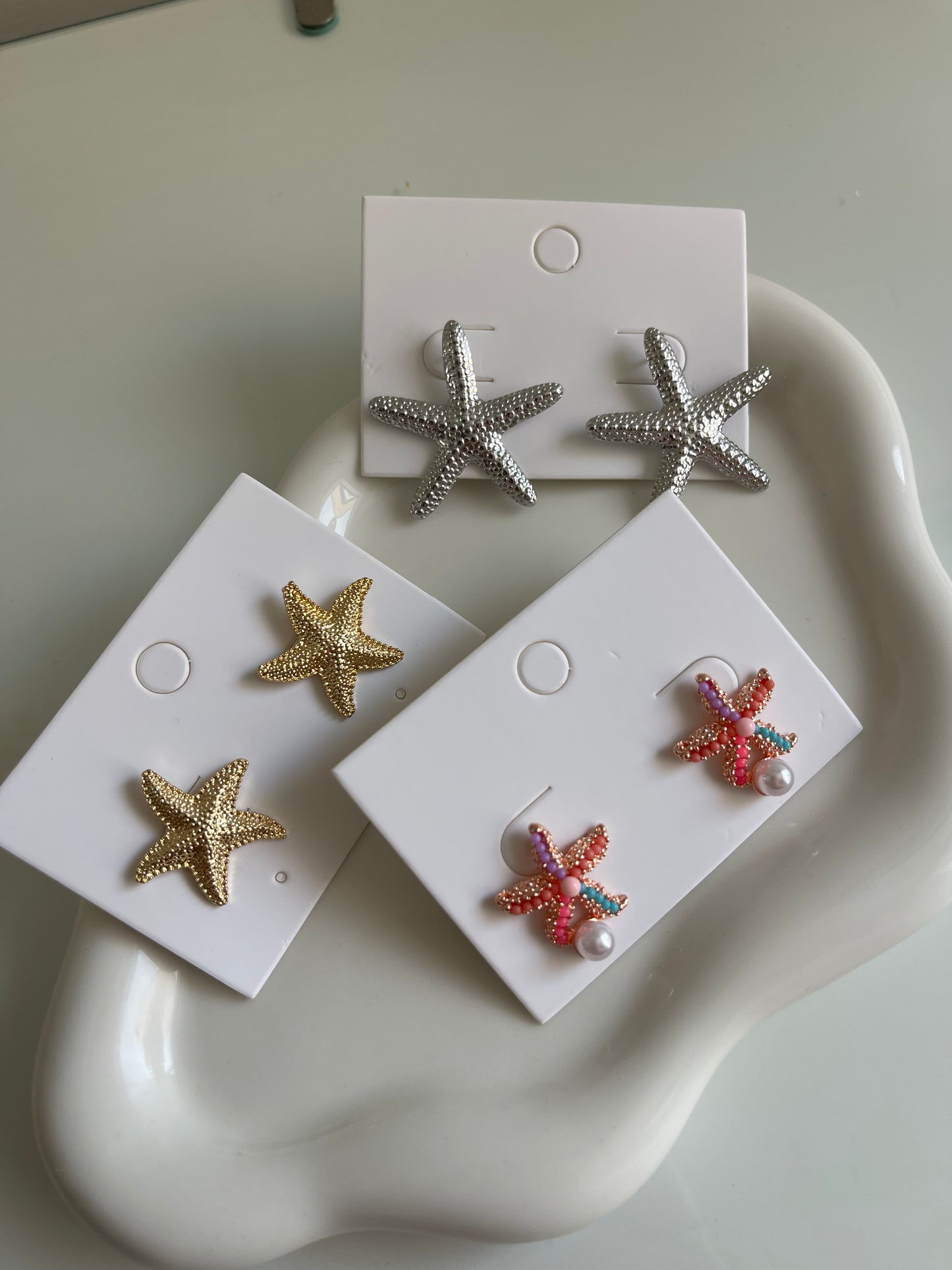 Gold starfish earrings